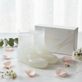 Simply Beautiful Baby Soft Exfoliating Foot Peel booties and box on marble