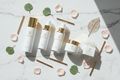 Simply Beautiful Complete Skincare System flatlay with all products on marble